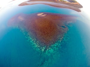 An aerial view of an inshore reef in the Kimberley which has been affected by coral bleaching.