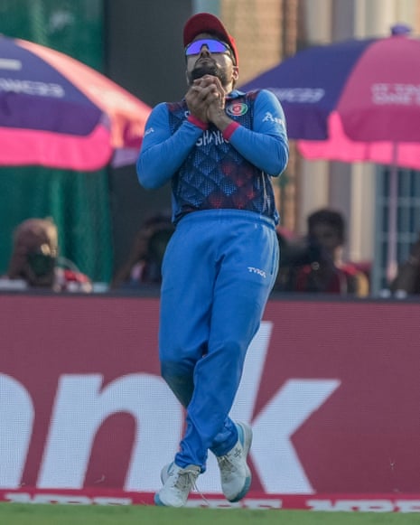 Afghanistan's Rashid Khan takes the catch to dismiss Pakistan's Saud Shakeel.