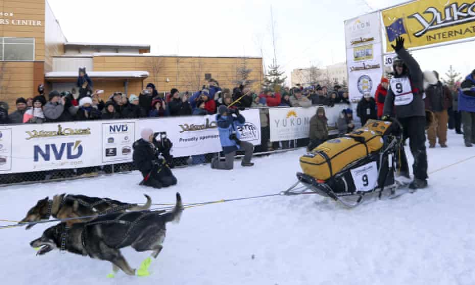Defending champion Brent Sass leaves the start chute to begin the Yukon Quest sled dog race on 6 February in Fairbanks, Alaska.