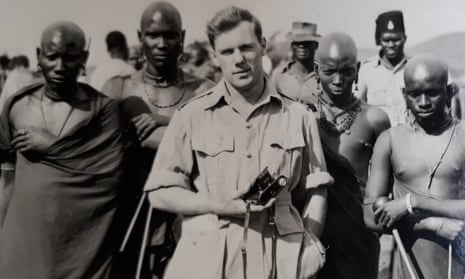 Hugh Walker with a group of Maasai men during his stint as a colonial administrator in Kenya in the 1950s