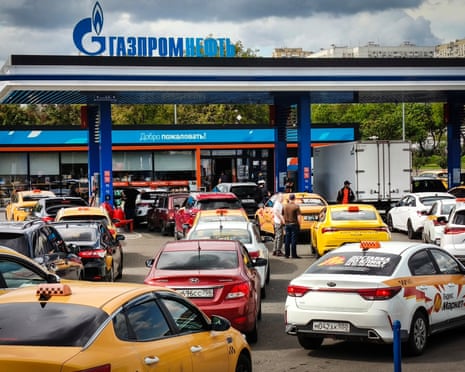 Vehicles queue at a a Gazpromneft petrol station in Moscow.