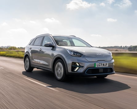A grey Kia e-Niro 64kWh driving along a road at speed