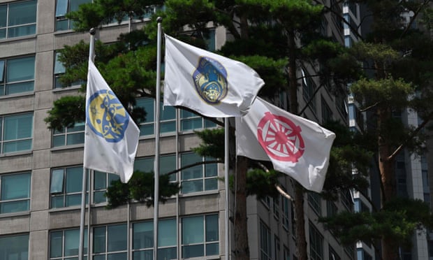 Flags outside a branch of the Unification church in Seoul, South Korea