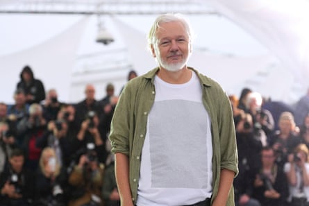 Julian Assange poses for photographers at the photo call for The Six Billion Dollar Man.