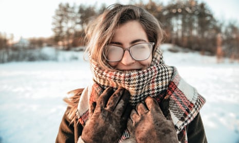 A model poses with foggy glasses on a cold winter’s day