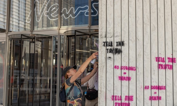 XR protesters smash windows of News UK over coverage of Britain’s heatwave | Climate crisis