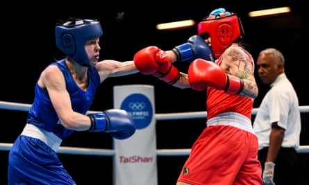 Charley Davison (left) lands a left on Carly McNaul during their bout at an Olympic qualifying event in March 2020.