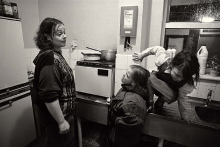 Mandy (mother) with L-R Emma and Donna in the kichen at the hostel for homeless families, Blackpool, 1992
