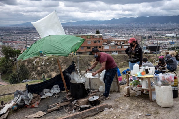 Some of the evicted inhabitants, about 60 people, set up a makeshift camp on a nearby sports field at La Ville Nue / The Bare CityBogotá on 15 May.