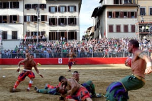 Players compete during the final match of the Calcio Storico Fiorentino (Historic Florentine Football) on Piazza Santa Croce in Florence
