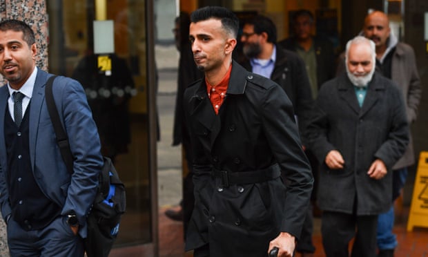 Protest group member Shakeel Afsar, centre, leaving Birmingham’s Civil Justice Centre.