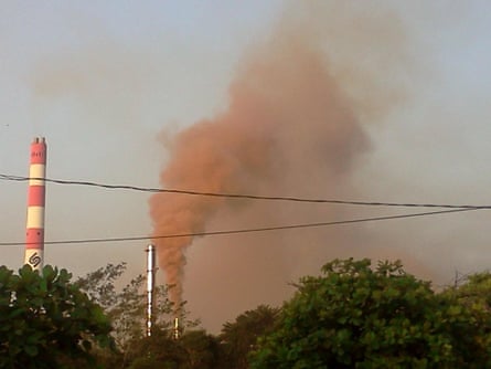 Red smoke rising from the Fenix refinery.