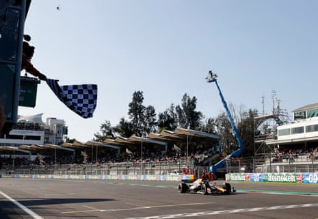 Red Bull's Max Verstappen passes the chequered flag to win the Mexico Grand Prix.