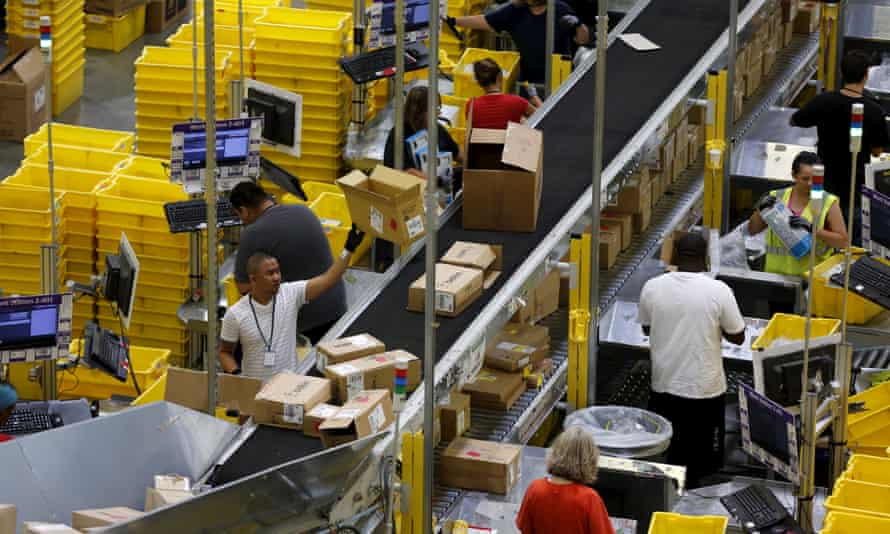 Workers sort arriving products at an Amazon fulfilment Centre.