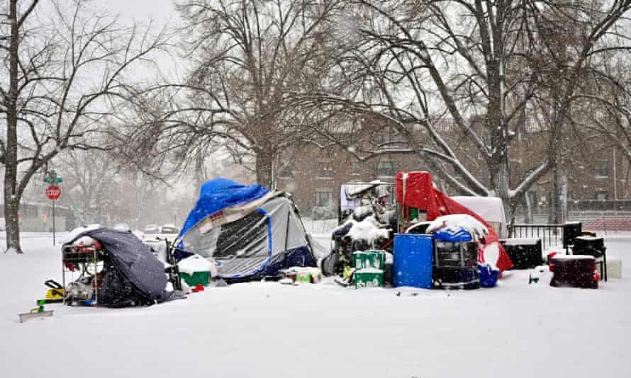 Snow covered tents in a homeless camp in Denver, Colorado, January 2022.