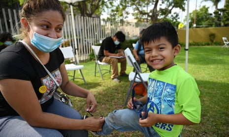 Rosa Gallagos with her son Herrick after she received her first vaccine dose at a community healthcare event in a predominately Latino neighborhood in Los Angeles in August. 