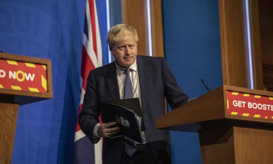 Boris Johnson looks on during a coronavirus media briefing in Downing Street