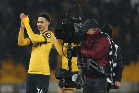 Tom Edozie followed by a TV camera operator.