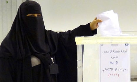 A Saudi woman casts her ballot in the capital of Riyadh.