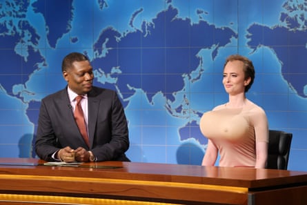 A man looks at a woman dressed as a man who’s dressed as a woman