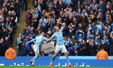Manchester City’s Erling Haaland celebrates scoring their fourth goal against Wolves with Phil Foden.