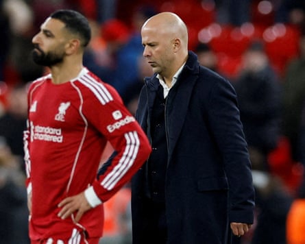 Liverpool’s Arne Slot (right) and Mohamed Salah