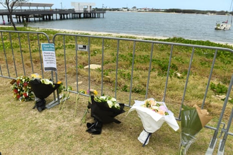 Floral tributes at the Broadwater Parklands on the Gold Coast, where four people were killed in a helicopter collision