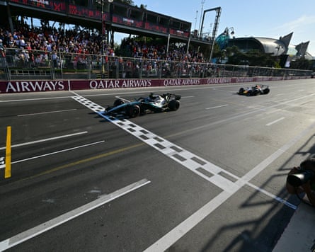 Mercedesâ George Russell crosses the line with Max Verstappen hot on his heels