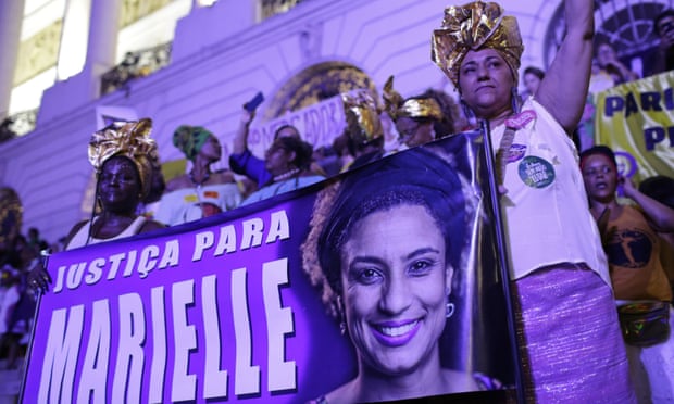 Carnival revellers hold a banner that reads ‘Justice for Marielle’ in Rio de Janeiro