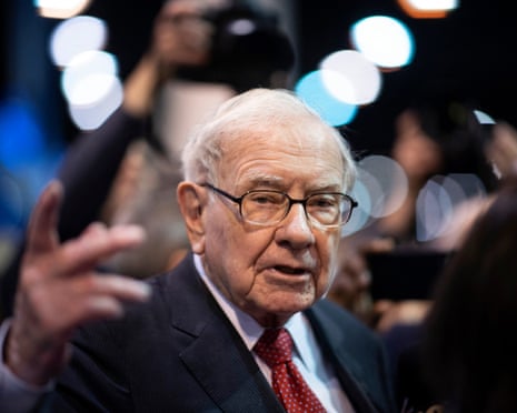 Man in suit and glasses gestures