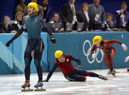 Australia’s Steven Bradbury crosses the line ahead of the USA’s Apolo Ohno (centre) and Canada’s Mathieu Turcotte to win gold