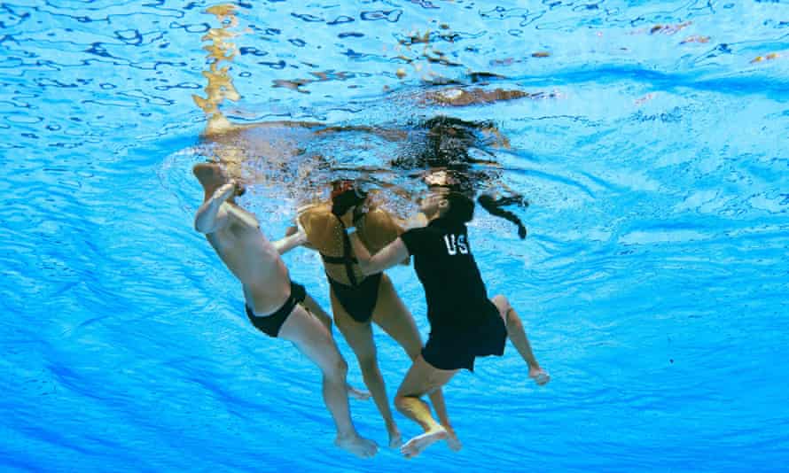 A member of Team USA recovers Anita Alvarez from the bottom of the pool