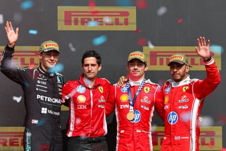 Ferrari’s Charles Leclerc of Monaco, Mercedes’ British driver George Russell, Ferrari’s British driver Lewis Hamilton and Ferrari’s race engineer Bryan Bozzi pose for photos on the podium