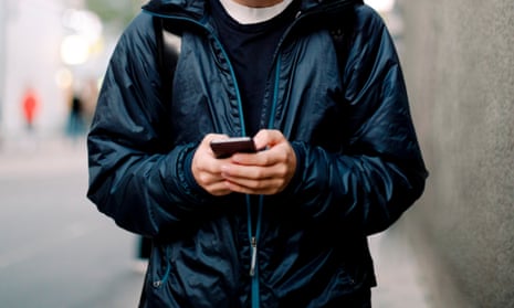 Teenage boy using mobile phone