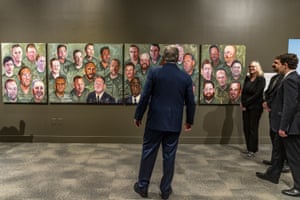 The former president George W Bush tours an exhibit of his paintings of military veterans at the Richard Nixon Presidential Library and Museum in California