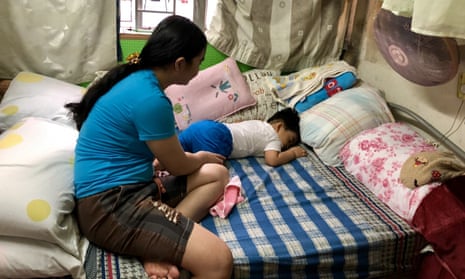 Filipino domestic worker in Hong Kong, Anna-Maria, looking over her baby son, Emmanuel