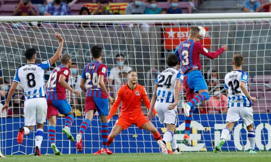 Gerard Pique rises highest to nod in Barcelona’s opener.