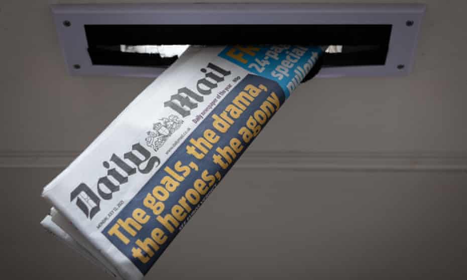 A copy of the Daily Mail newspaper in a letterbox