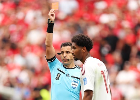 Homam Ahmed is shown the red card by the referee