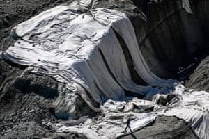 Big sheets are used to slow down the melting glacier