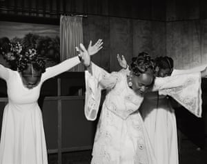 Praise Dancers, Edna, Texas, 2020 This photograph in South Texas shows three women participating in a tradition known as praise dancing. The woman in the front is teaching the two younger women in the back; in this photograph, you see the passing down of a generation with a long, rooted history in the black Baptist churches in Texas. Working on Hardtack, I became fascinated with how spirituality has played a vital role in black American politics and social activism. This concept is that the work done inside of the church ultimately benefits the people on the outside. 