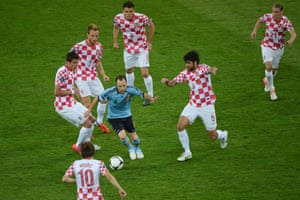 Spain’s Andres Iniesta causes problems for the Croatian players during Euro 2012.