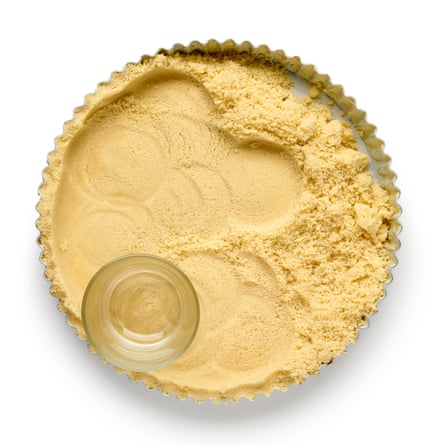 Once you’ve mixed the butter, flour and sugar to crumbs, pack them into a tart case and blind bake.
