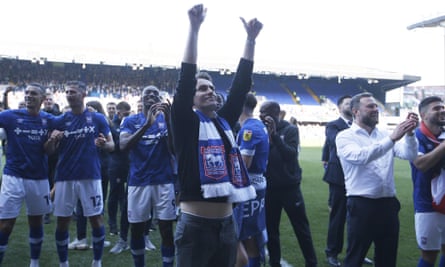 Kieran McKenna salutes the Ipswich fans after his side seal promotion to the Championship with a 6-0 thrashing of Exeter on 29 April