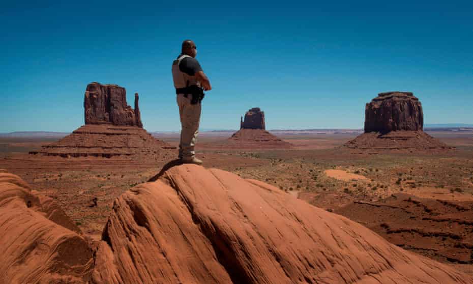 A Navajo park ranger looks out over Navajo Nation-managed Monument Valley Tribal park in Arizona.