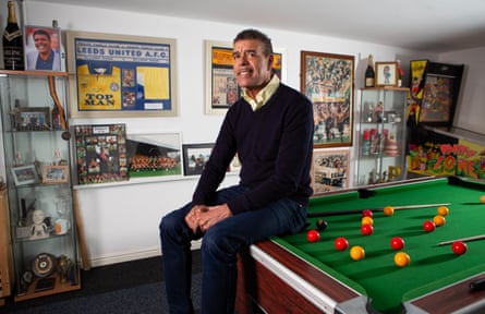 Former footballer and sports presenter Chris Kamara in a games room at his home