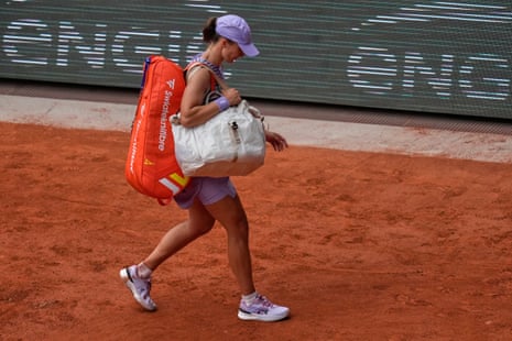 Poland's Iga Swiatek leaves the court after losing.