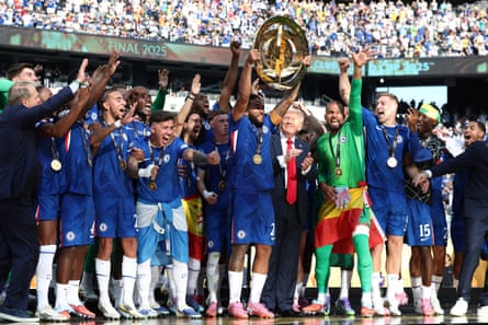 Chelsea's Reece James lifts the trophy as he celebrates with teammates and President Donald Trump, fifth from right, after Chelsea won against Paris St Germain in the Club World Cup final, at MetLife Stadium in East Rutherford, N.J., Sunday, July 13, 2025.