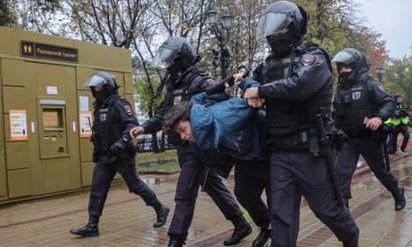 Russian policemen detain a person taking part in an unauthorised protest against Russia’s partial military mobilisation due to the conflict in Ukraine, in downtown Moscow.