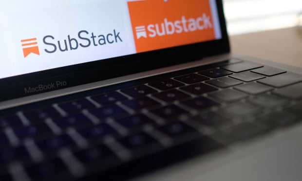 A laptop screen displays the Substack logo